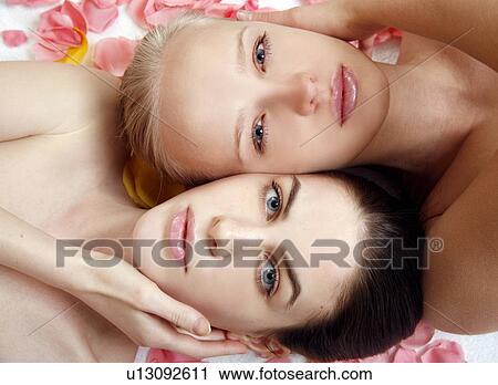 Beauty shot of two young faces side by side View Large Photo Image Stock Image - Beauty shot of two young faces side by side. Fotosearch