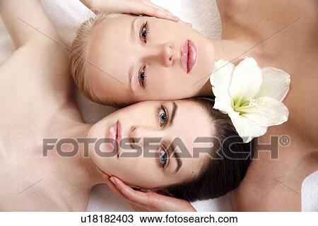 Beauty shot of two young faces side by side View Large Photo Image Stock Image - Beauty shot of two young faces side by side. Fotosearch