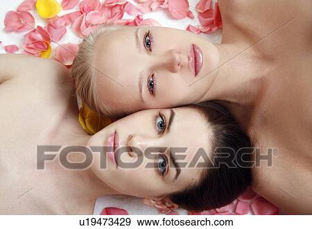 Beauty shot of two young faces side by side View Large Photo Image Stock Photo - Beauty shot of two young faces side by side. Fotosearch