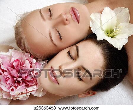 Beauty shot of two young faces side by side View Large Photo Image Stock Photo - Beauty shot of two young faces side by side. Fotosearch