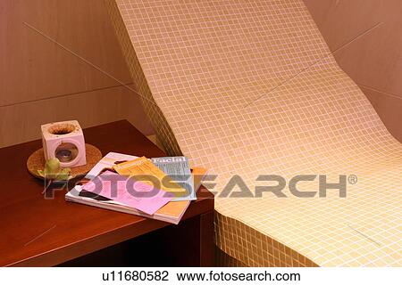 Stock Image - Chaise lounge and sidetable. Fotosearch