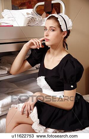 Hotel maid taking a break View Large Photo Image Stock Image - Hotel maid taking a break. Fotosearch
