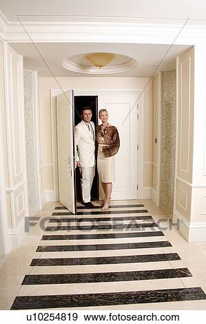 Mature couple entering a hotel suite View Large Photo Image Stock Photo - Mature couple entering a hotel suite. Fotosearch