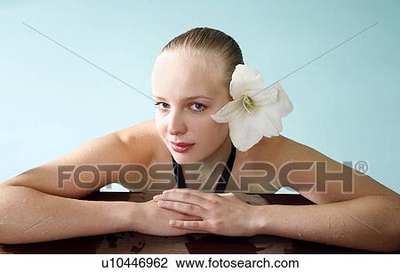 Young woman in a swimming pool at a spa View Large Photo Image Stock Image - Young woman in a swimming pool at a spa. Fotosearch