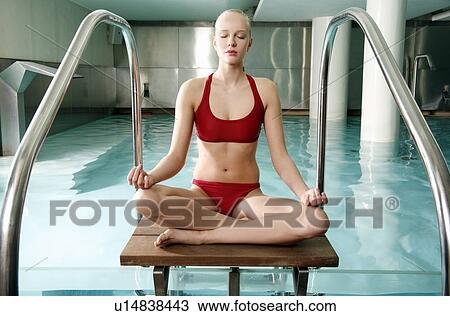 Young woman in a swimming pool at a spa View Large Photo Image Stock Image - Young woman in a swimming pool at a spa. Fotosearch