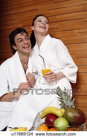 Picture - A couple having a refreshment after a spa treatment. Fotosearch