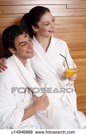 Stock Photo - A couple having a refreshment after a spa treatment. Fotosearch