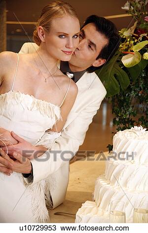 Bride and groom with cake View Large Photo Image Stock Image - Bride and groom with cake. Fotosearch