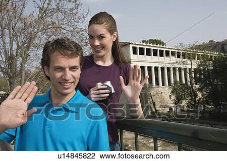 Couple at archaeological site waving View Large Photo Image Stock Image - Couple at archaeological site waving. Fotosearch