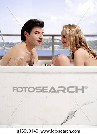 Couple enjoying bubble bath together View Large Photo Image Stock Image - Couple enjoying bubble bath together. Fotosearch