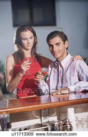 Stock Photo - Couple in a bar. Fotosearch