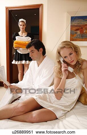 Couple on bed in hotel room View Large Photo Image Stock Image - Couple on bed in hotel room. Fotosearch