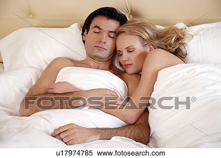 Couple sleeping in bed View Large Photo Image Stock Photography - Couple sleeping in bed. Fotosearch