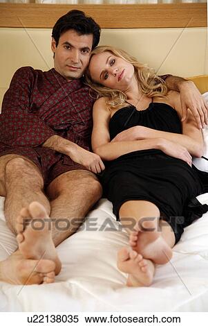 Couple sleeping in bed View Large Photo Image Stock Photography - Couple sleeping in bed. Fotosearch