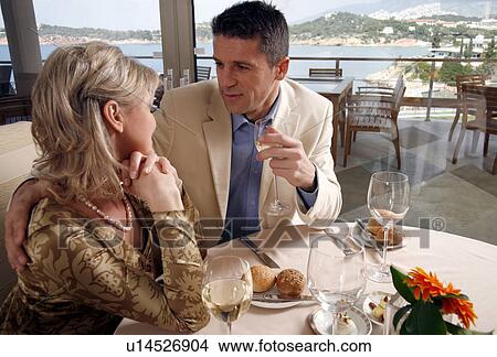 Picture - Mature couple dining in a restaurant. Fotosearch
