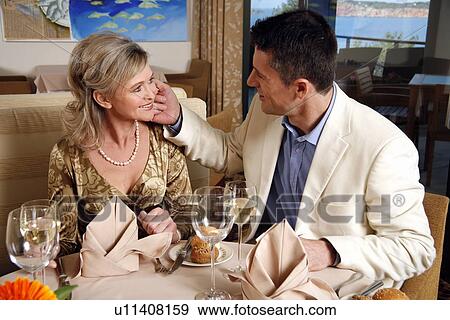 Stock Photo - Mature couple dining in a restaurant. Fotosearch