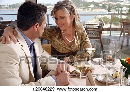 Stock Photo - Mature couple dining in a restaurant. Fotosearch