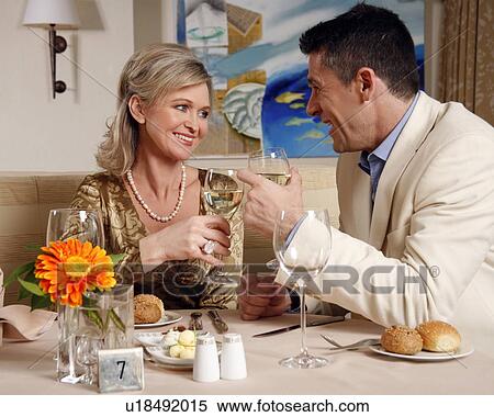 Stock Photography - Mature couple dining in a restaurant. Fotosearch