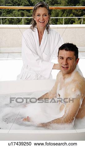 Mature couple having fun in the bathtub View Large Photo Image Stock Image - Mature couple having fun in the bathtub. Fotosearch