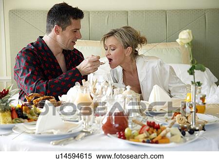 Stock Photography - Mature couple having room service breakfast. Fotosearch