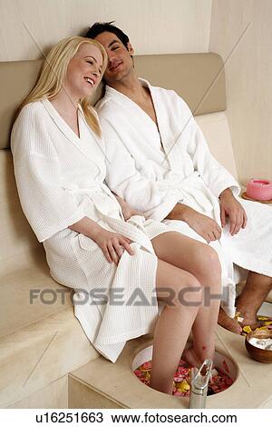 A young couple enjoying a foot bath with rose petals View Large Photo Image Stock Image - A young couple enjoying a foot bath with rose petals. Fotosearch