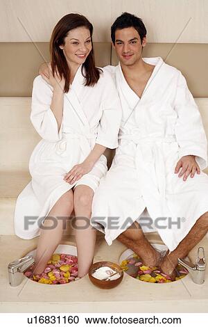 A young couple enjoying a foot bath with rose petals View Large Photo Image Stock Image - A young couple enjoying a foot bath with rose petals. Fotosearch
