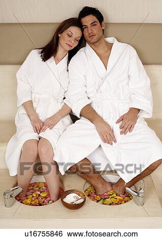 A young couple enjoying a foot bath with rose petals View Large Photo Image Stock Photograph - A young couple enjoying a foot bath with rose petals. Fotosearch