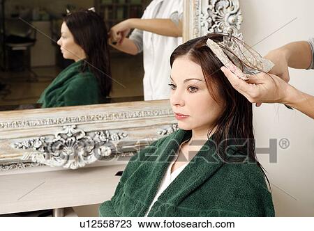 Young woman having her hair colored View Large Photo Image Stock Image - Young woman having her hair colored. Fotosearch