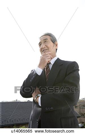 A Senior Adult Man in a Suit Under the Sky, Side View, Low Angle View View Large Photo Image Stock Photography - A Senior Adult Man in a Suit Under the Sky, Side View, Low Angle View. Fotosearch