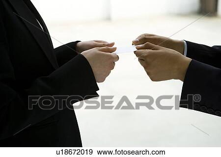 Close-up Image of Exchanging Business Cards, Side View View Large Photo Image Stock Photo - Close-up Image of Exchanging Business Cards, Side View. Fotosearch