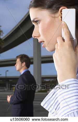 Closed Up Image of a Businesswoman Talking on a Cellular Phone, Side View, Differential Focus View Large Photo Image Stock Image - Closed Up Image of a Businesswoman Talking on a Cellular Phone, Side View, Differential Focus. Fotosearch