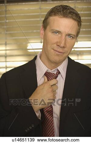 Portrait of a Mid Adult Businessman, Looking at Camera, Front View, Waist Up, Differential Focus View Large Photo Image Stock Photo - Portrait of a Mid Adult Businessman, Looking at Camera, Front View, Waist Up, Differential Focus. Fotosearch