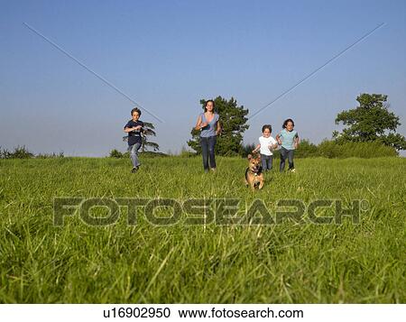 Group of kids running in a field. View Large Photo Image Stock Image - Group of kids running in a field.. Fotosearch