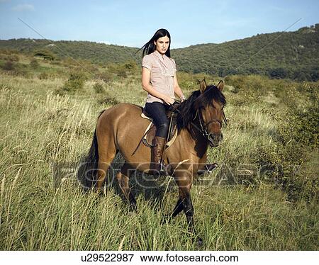 Woman riding horse. View Large Photo Image Stock Photo - Woman riding horse.. Fotosearch