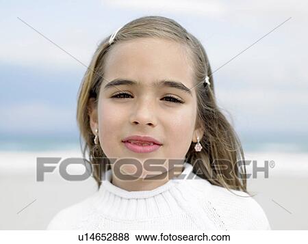 Girl (6-8) on beach, portrait, close-up View Large Photo Image Stock Photo - Girl (6-8) on beach, portrait, close-up. Fotosearch