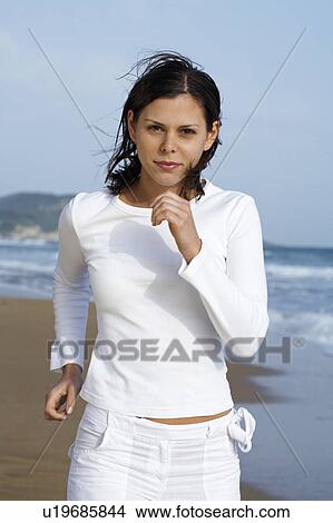Young woman jogging on beach. View Large Photo Image Picture - Young woman jogging on beach.. Fotosearch