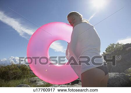 Young woman with swimming ring. View Large Photo Image Stock Photo - Young woman with swimming ring.. Fotosearch