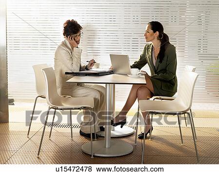 Stock Photo - Businesswomen in a restaurant.. Fotosearch