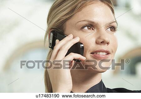 Stock Image - Close-Up portrait of Business woman using mobile phone.. Fotosearch