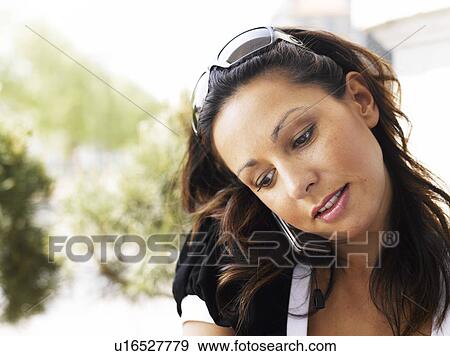 Stock Photo - Woman standing outdoors . Fotosearch