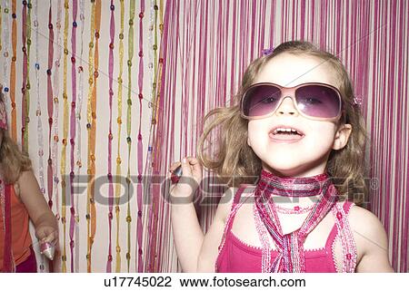 Girl (2-4)in party clothes singing, friend (2-4) in background. View Large Photo Image Stock Image - Girl (2-4)in party clothes singing, friend (2-4) in background.. Fotosearch