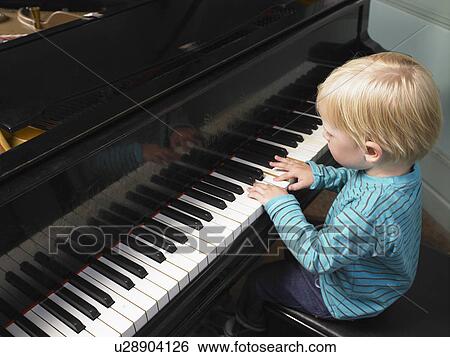 Little boy playing piano. View Large Photo Image Stock Photograph - Little boy playing piano.. Fotosearch