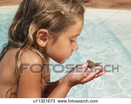 Little girl holding a frog. View Large Photo Image Stock Image - Little girl holding a frog.. Fotosearch
