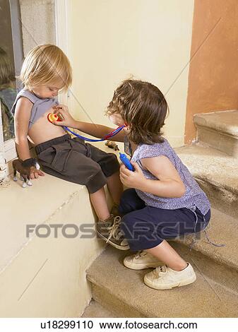 Little girls playing doctor. View Large Photo Image Stock Image - Little girls playing doctor.. Fotosearch