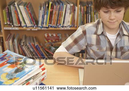 Stock Image - Boy on computer. Fotosearch