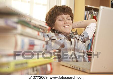 Stock Photo - Boy on computer. Fotosearch