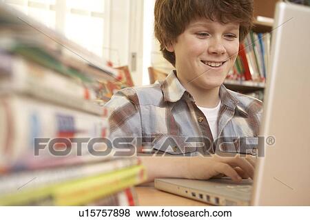 Stock Photo - Boy on computer. Fotosearch