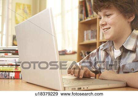 Boy on computer View Large Photo Image Stock Photo - Boy on computer. Fotosearch