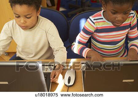 Stock Photography - Children on computer. Fotosearch