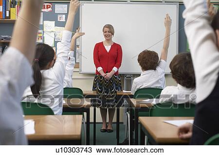 Children raising hands in classroom View Large Photo Image Stock Image - Children raising hands in classroom. Fotosearch